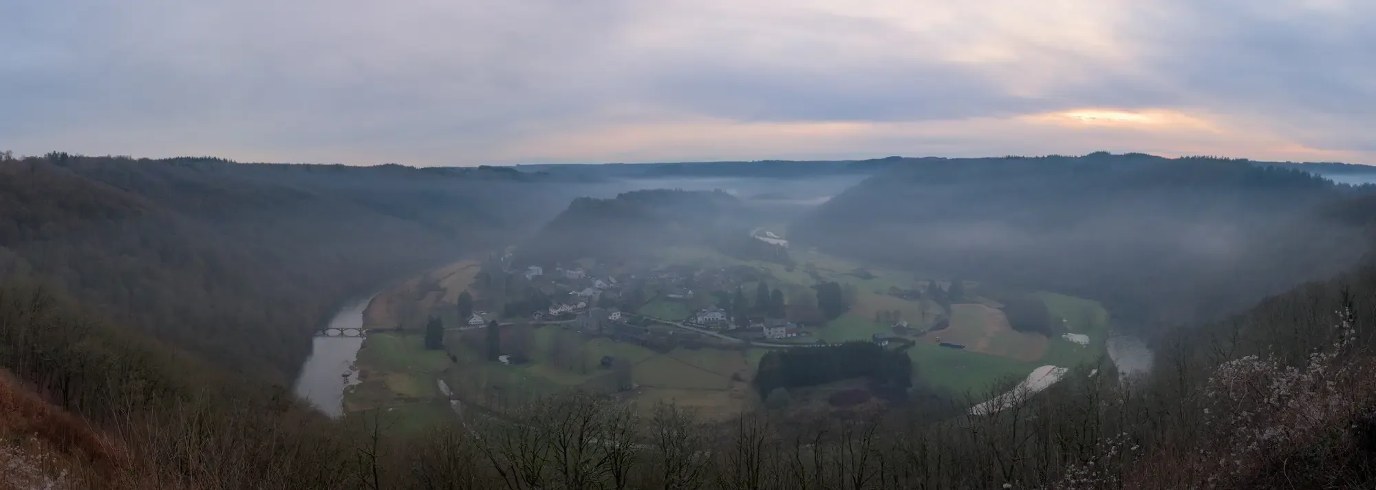 The Semois looping almost the whole way around the hamlet of Frahan, seen from Rochehaut in low winter light
