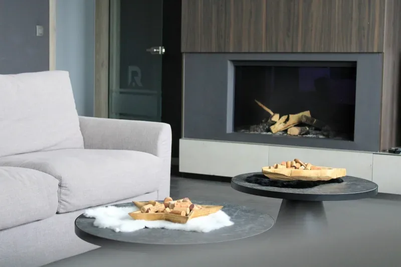 Pale sofas drawn up around the gas fire